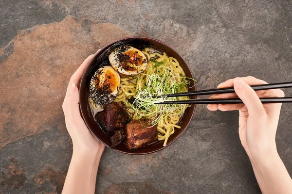 Cropped View Woman Eating Spicy Meat Ramen Chopsticks Stone Surface — Stock Photo, Image