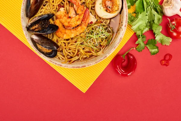 Top View Spicy Seafood Ramen Fresh Ingredients Yellow Red Surface — Stock Photo, Image