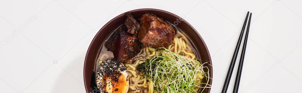 Top view of spicy meat ramen near chopsticks on white surface, panoramic shot — Stock Image Top View Spicy Meat Ramen Chopsticks White Surface Panoramic Shot Stock Image