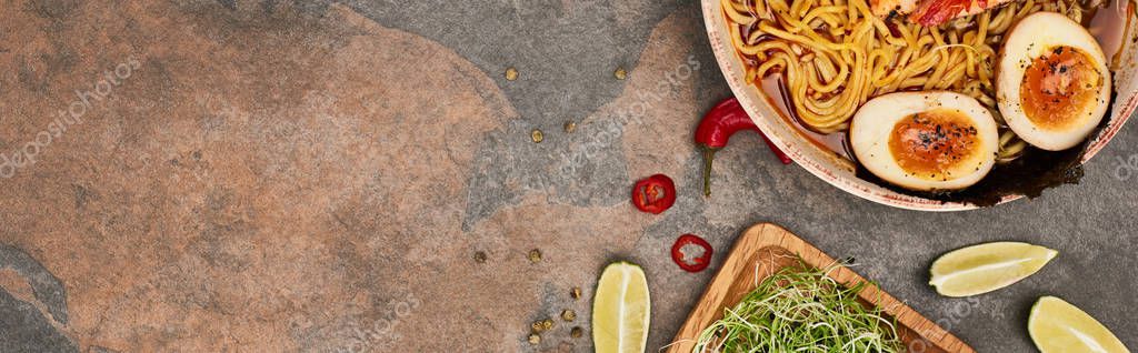 Top view of spicy seafood ramen near fresh ingredients on stone surface, panoramic shot — Stock Image Top View Spicy Seafood Ramen Fresh Ingredients Stone Surface Panoramic Royalty Free Stock Images