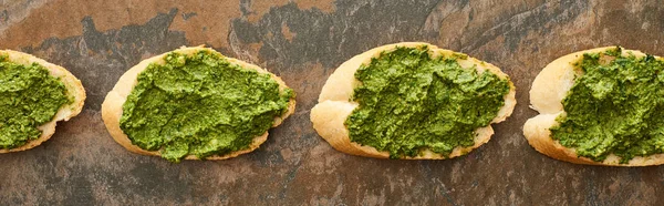 Flat Lay Baguette Slices Delicious Pesto Sauce Stone Surface Panoramic — Stock Photo, Image