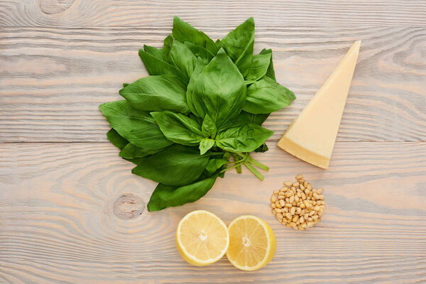 top view of pesto sauce raw ingredients on wooden table