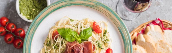 Selective Focus Served Pappardelle Tomatoes Basil Prosciutto Baguette Red Wine — Stock Photo, Image