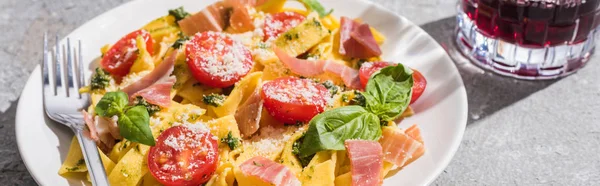 Tasty Pappardelle Tomatoes Pesto Prosciutto Fork Red Wine Grey Surface — Stock Photo, Image