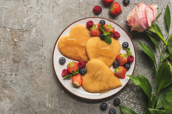 Top View Heart Shaped Pancakes Berries Grey Concrete Surface Rose — Stock Photo, Image