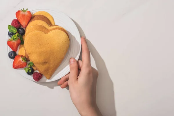 Cropped View Woman Holding Plate Heart Shaped Pancakes Tasty Berries — Stock Photo, Image