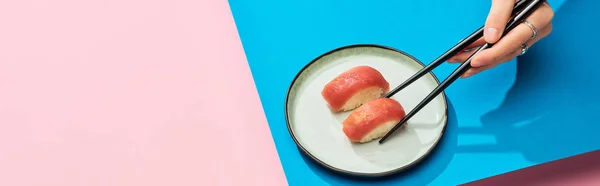 Partial View Woman Eating Fresh Nigiri Tuna Chopsticks Blue Pink — Stock Photo, Image