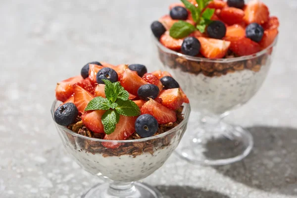 Selective Focus Delicious Granola Berries Yogurt Chia Seeds Grey Concrete — Stockfoto