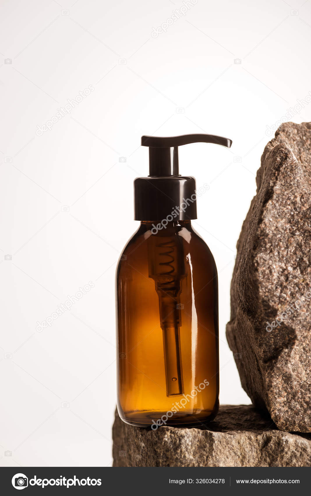 Botella Cosmética Dispensadora Piedras Fondo Blanco Con Luz Posterior