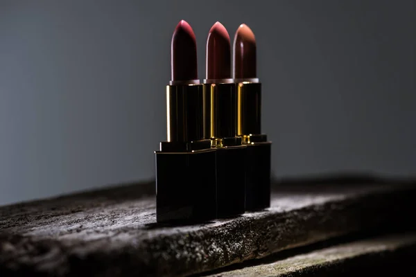 Lipsticks Arranged Line Stone Dark — Stock Photo, Image