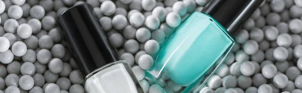 Top View Blue White Nail Polish Bottles Grey Decorative Beads — Stock Photo, Image