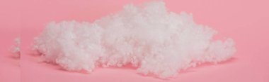 white fluffy cloud made of cotton wool on pink background, panoramic shot clipart