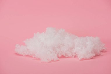 white fluffy cloud made of cotton wool on pink background clipart