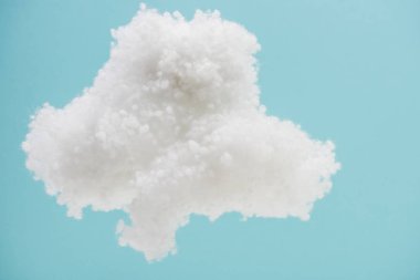 white fluffy cloud made of cotton wool isolated on blue background clipart