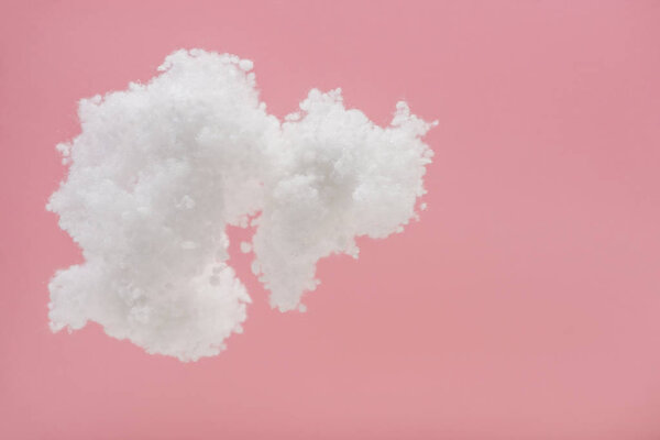 white fluffy cloud made of cotton wool isolated on pink