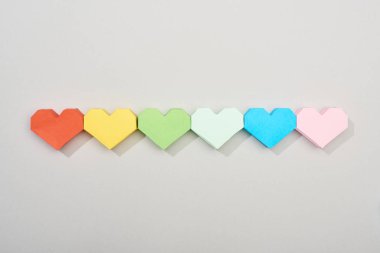 Top view of paper hearts on grey background clipart