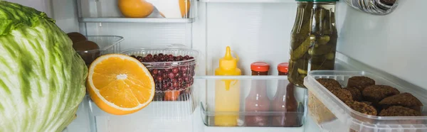 Panoramic Shot Fresh Fruits Cabbage Cutlets Sauces Refrigerator — Stock Photo, Image