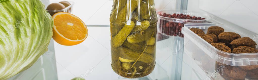 Panoramic shot of pickles with cutlets and fresh fruits on fridge shelf isolated on white — Stock Image Panoramic Shot Pickles Cutlets Fresh Fruits Fridge Shelf Isolated White Stock Picture