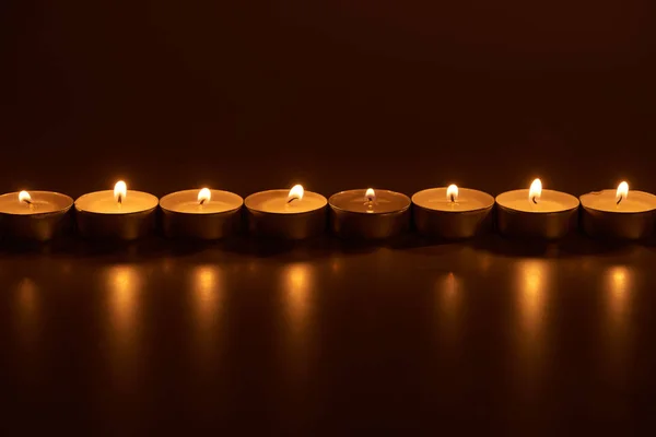 Burning White Candles Glowing Dark — Stock Photo, Image