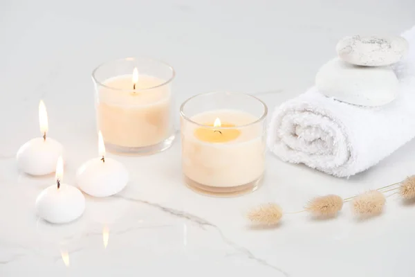 Fluffy Bunny Tail Grass Burning White Candles Glass Rolled Towel — Stock Photo, Image