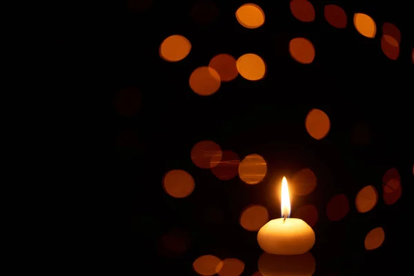 Burning Candle Glowing Dark Bokeh Lights Background — Stock Photo, Image