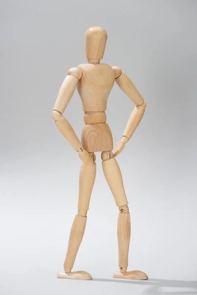 Wooden Puppet Akimbo Pose Grey Background — Stock Photo, Image