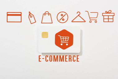 top view of credit card on white background with e-commerce illustration