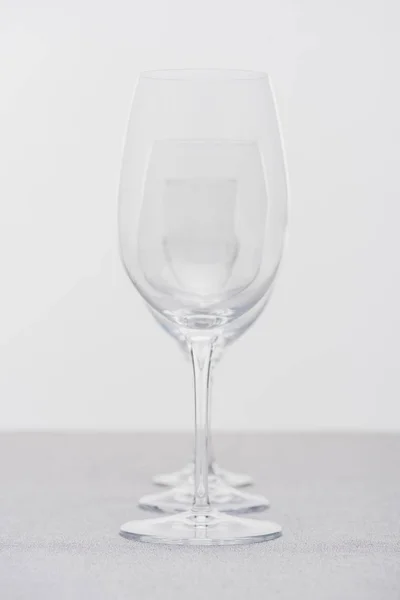 Row Clear Wine Glasses Cloth Isolated Grey — ストック写真