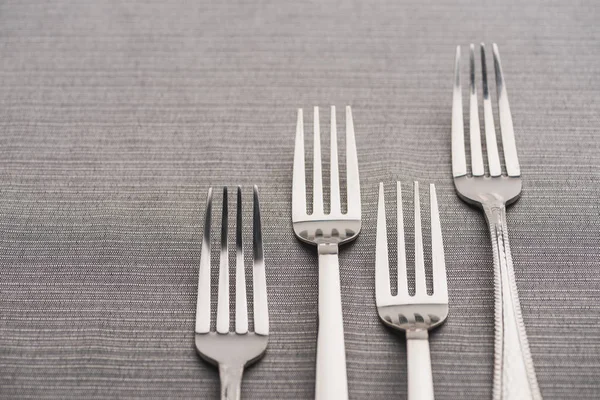 Close View Shiny Forks Grey Tablecloth — Stock Photo, Image