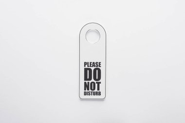 top view of please do no disturb sign on white background clipart