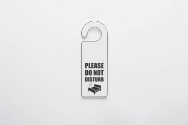 top view of please do no disturb sign on white background clipart