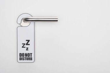 do no disturb sign on handle on white background clipart
