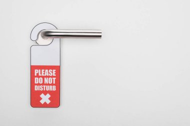 please do no disturb sign on handle on white background clipart