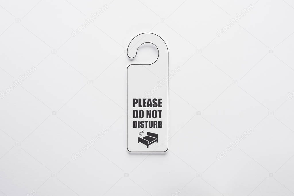 top view of please do no disturb sign on white background