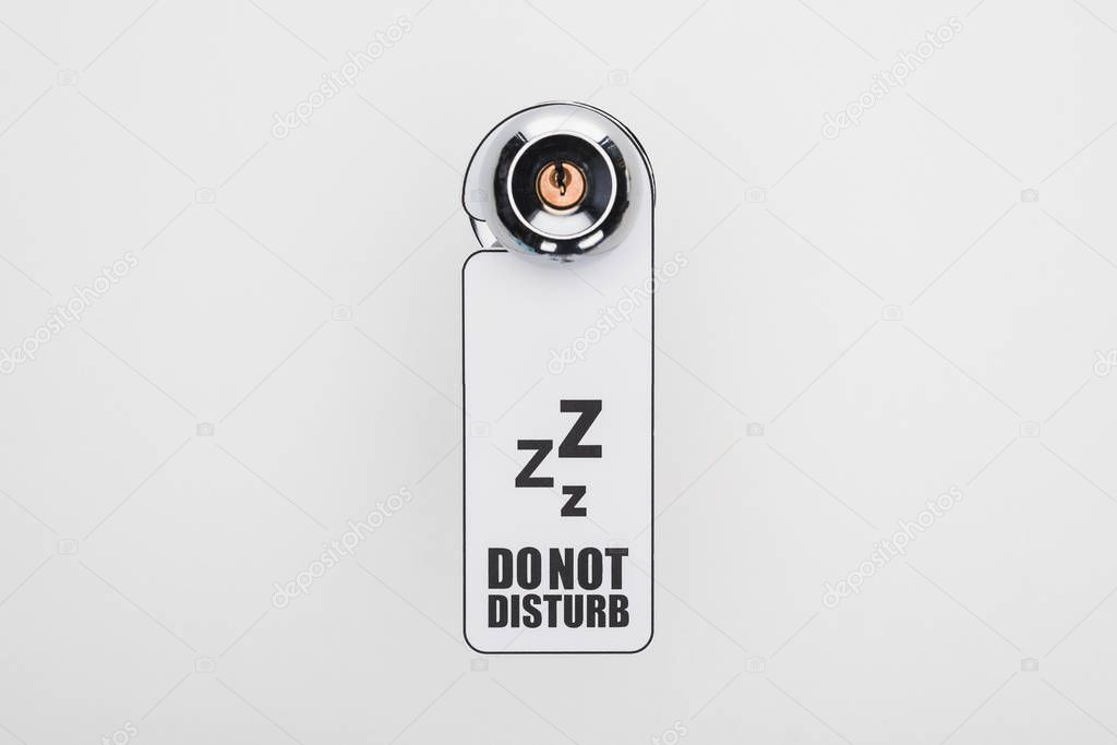 do no disturb sign on handle with lock on white background