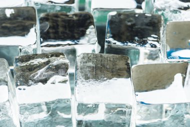 close up view of melting transparent clear square ice cubes clipart