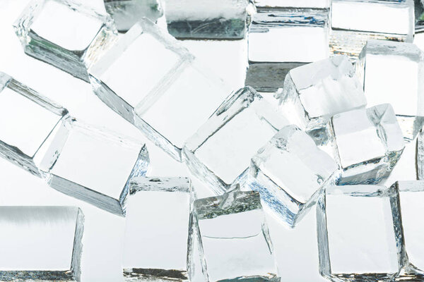 transparent clear square ice cubes on mirror