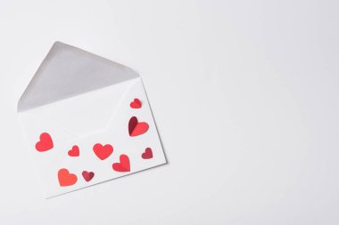 top view of valentines envelope with red hearts on white background clipart