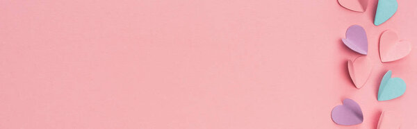 top view of colorful paper hearts on pink background, panoramic shot