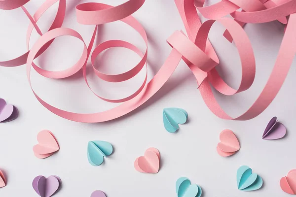 Top View Small Paper Hearts Pink Paper Swirl White Background — 스톡 사진