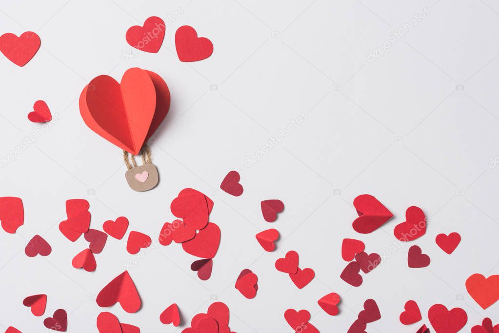top view of red heart with padlock among hearts on white background