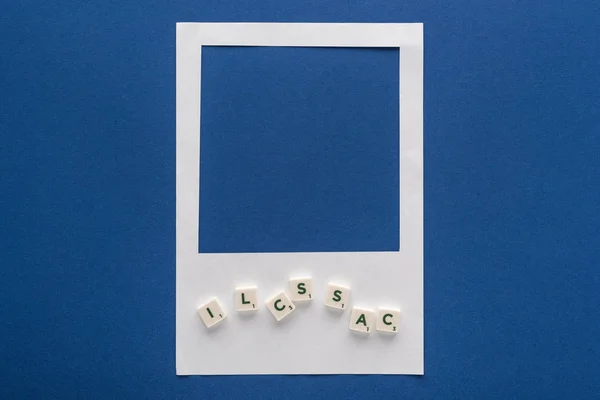 Top View Letters Cubes White Photo Frame Blue Background — Stock Photo, Image