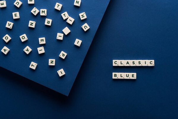 top view of classic blue lettering on cubes on blue background