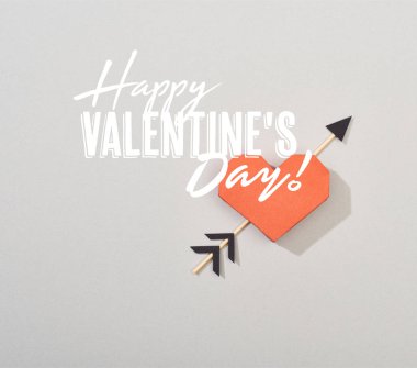 Top view of decorative paper heart with arrow on grey background with happy valentines day illustration 