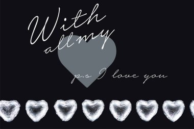 Top view of heart shaped candies isolated on black with all my and ps i love you lettering clipart