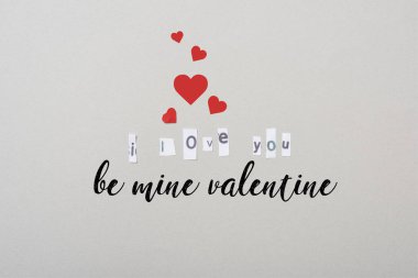 Top view of i love you lettering with hearts and be mine valentine illustration isolated on grey