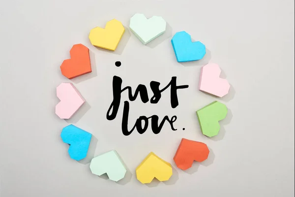 Top View Frame Colorful Paper Hearts Grey Background Just Love — Stok fotoğraf