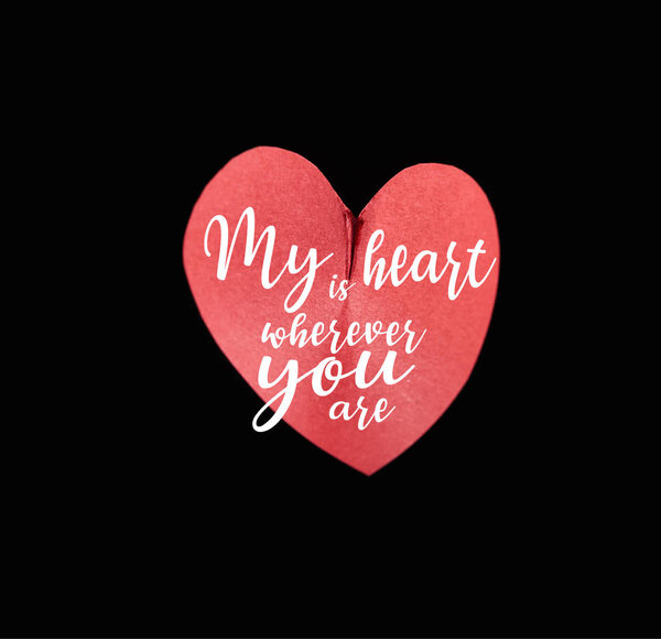 Top view of red paper in heart shape isolated on black with my heart is wherever you are illustration