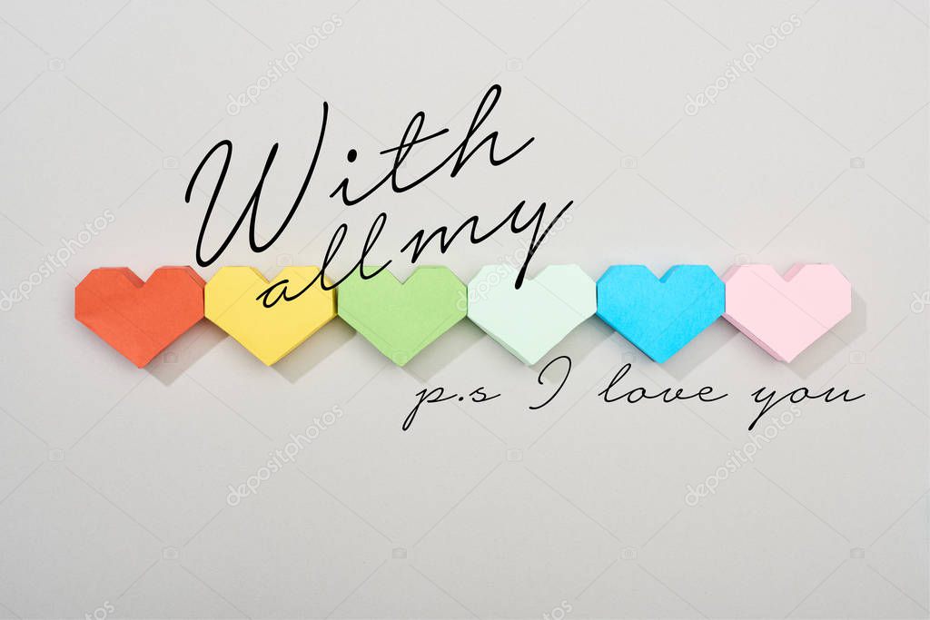 Top view of paper hearts on grey background with all my and ps i love you illustration