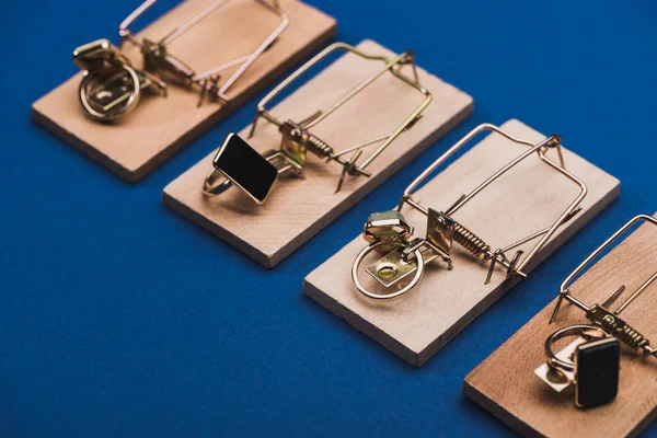 Close View Row Mousetraps Jewellery Rings Blue Background — 스톡 사진